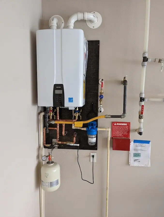 Professional plumber installing copper piping in a Carolina Beach home